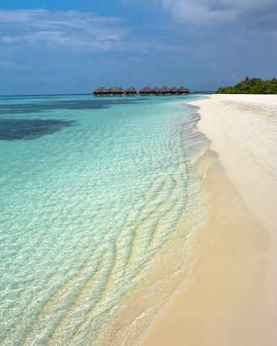 white sand beach during daytime