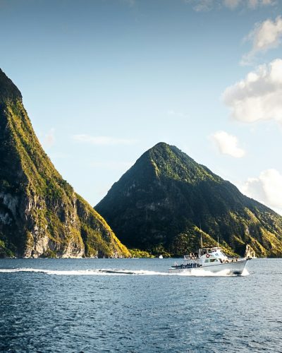 white yacht on body of water